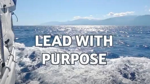 Lead with Purpose text with boat making waves in the ocean The Game Changers Inc Eric Boles coaching keynoting training