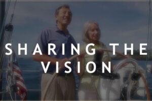 Sharing the Vision with man and woman at helm of sailboat The Game Changers Inc Eric Boles coaching keynoting training